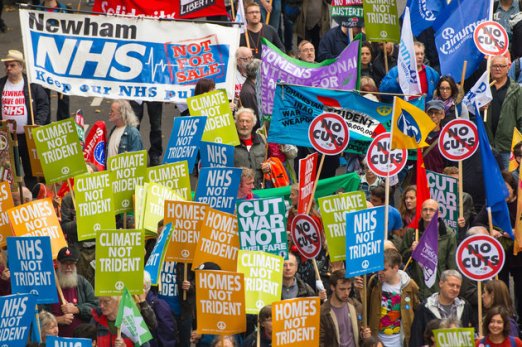 Demonstrators take part in the 'Britain Needs a Pay Rise' march in central London, organised by the TUC as public sector workers are calling for an end to austerity and to highlight the need for pay to increase following days of industrial action by nurses, midwives and civil servants.